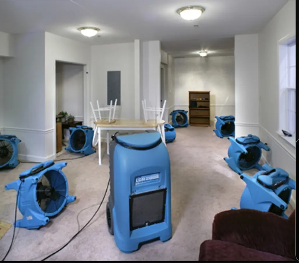 Air movers and dehumidifier setup for Water Damage Restoration in Manistee